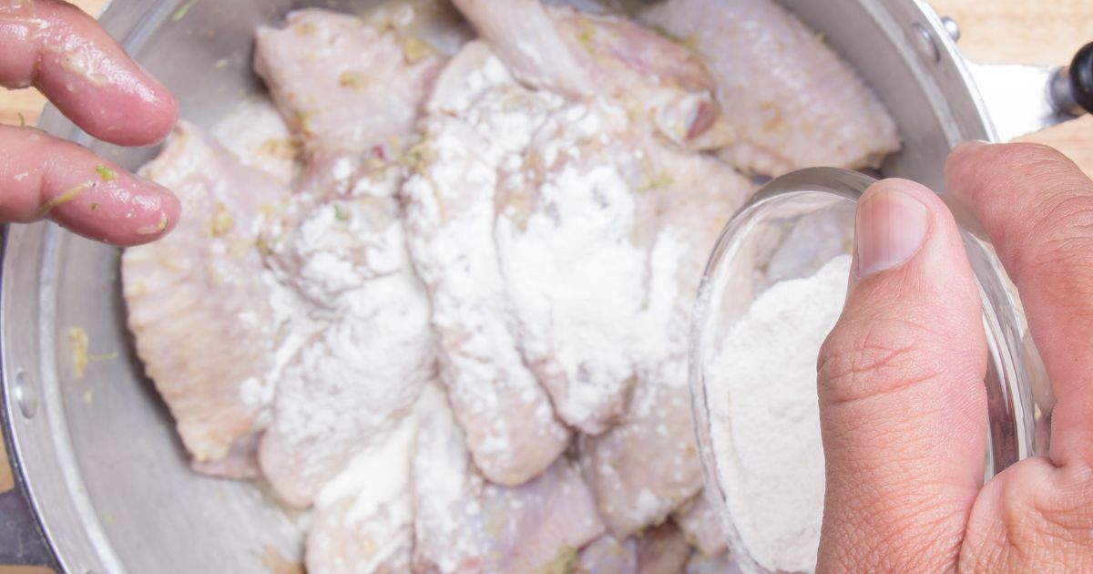 chicken piece in the flour mixture